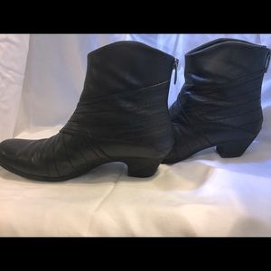 Black leather boots .